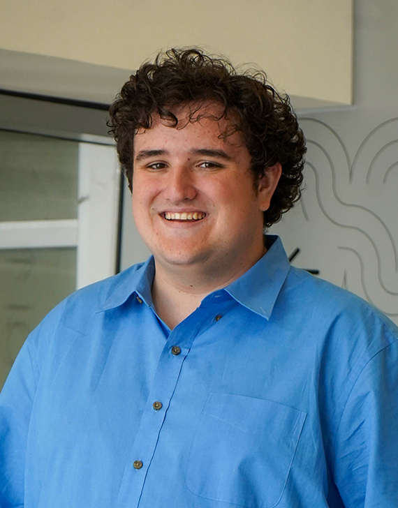 Person in front of background for headshot photo