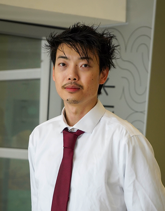 Person in front of background for headshot photo